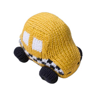 Yarn stitched rattle in the shaped of a yellow taxi with white and black accents