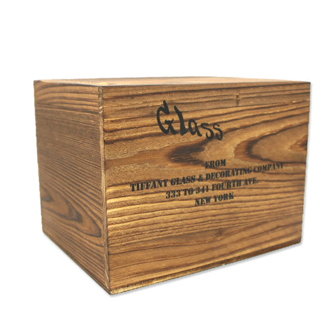 A wooden crate packaging with the engraved text 