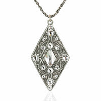Silver crystal pendant in the shape of a diamond with encrusted white gemstones on a silver necklace