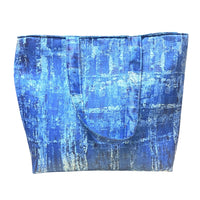 Blue textured tote bag on a white background