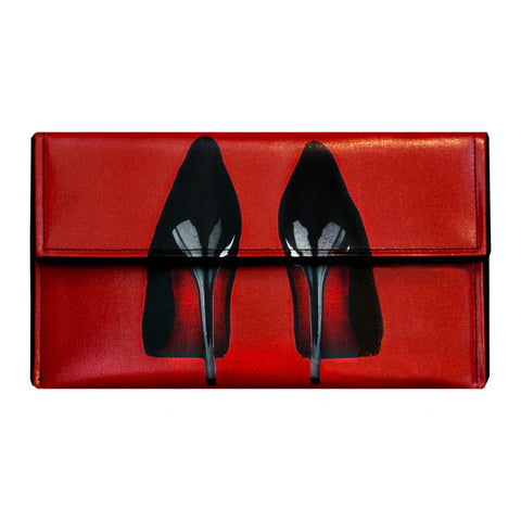 Red clutch bag with black high-heeled shoes