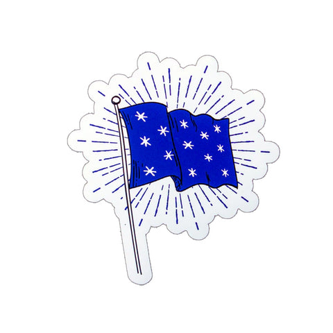 A die cut sticker in the shape of a blue flag with six stars on a starburst of lines