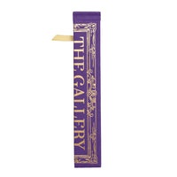 A purple folding fan depicting a cover of a book with the text 