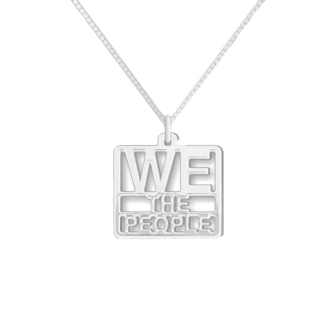 A silver pendant with the text 