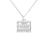 A silver pendant with the text 