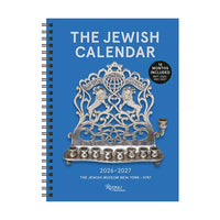 The front of a blue planner with a silver ornate menorah with two lions facing away from each other and a star of david at it's center. The title of the planner is 