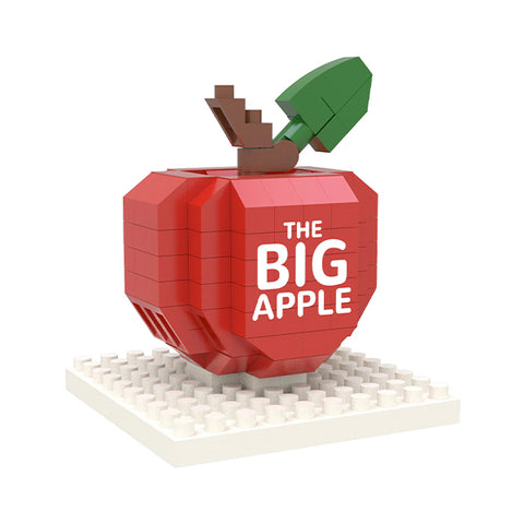A miniature red apple-shaped buidling block with 'The Big Apple' text 