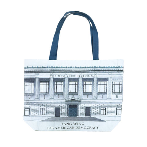 A canvas tote bag featuring an illustration of The New York Historical Building with the text 'THE NEW YORK HISTORICAL' and 'TANG WING FOR AMERICAN DEMOCRACY'with teal handles.