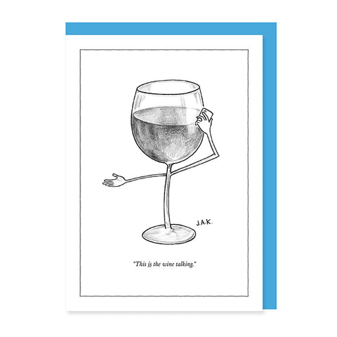 A white greeting card with a blue envelope behind the notecards with a black-and-white illustration of a wine glass with arms and legs, captioned 'This is the wine talking.' by J.A.K