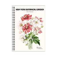 A spiral-bound 2027 planner from the New York Botanical Garden, featuring a vintage-style botanical illustration of pink, white, and red flowers with green leaves