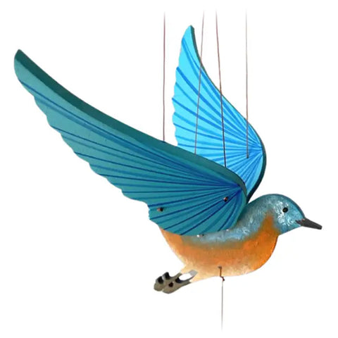 Image of a wooden mobile depicting a eastern bluebird with an orange chest flying mid air