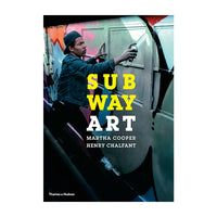 Book cover for 'Subway Art' by Martha Cooper and Henry Chalfant, published by Thames & Hudson. The cover features a photo of a man spray-painting a subway train, with the title 'SUBWAY ART' in bold yellow and white text.