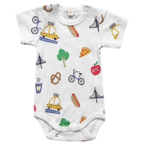 A white body suit with New York icons as a scattered print in the colors yellow, blue, green, red, blue, and black.