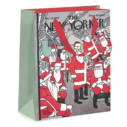 A New Yorker magazine cover gift bag featuring a holiday cartoon illustration of Santa Claus characters on the front cover, with a red handle and mint green side panels.
