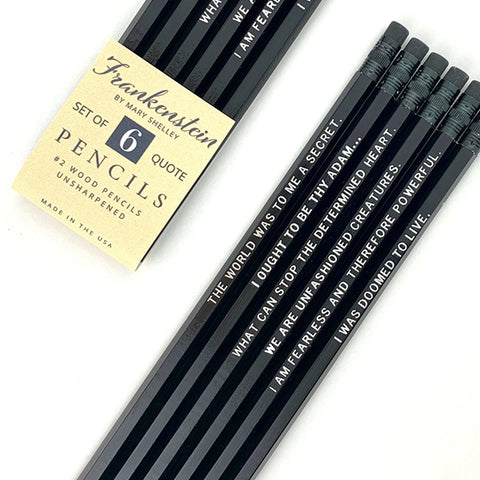 A set of six black wood quote pencils with white text, featuring a vintage-style paper label that reads 'Frankenstein by Mary Shelley' and 'Set of 6 Quote Pencils'.