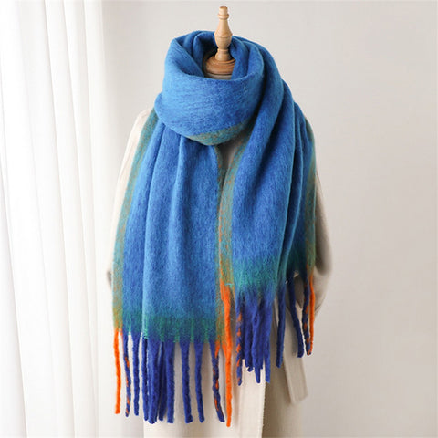Blue plaid scarf with fringe on a white background