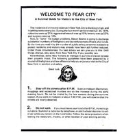 A black-and-white printed informational brochure titled 'WELCOME TO FEAR CITY' with paragraphs of text and a small black-and-white illustration of a hooded skull head.