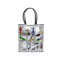 A tote bag featuring a printed design with various illustrations of shoes from the Stuart Weitzman collection.