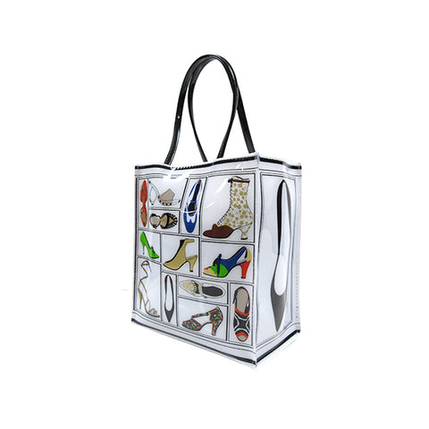 A tote bag featuring a printed design with various illustrations of shoes from the Stuart Weitzman collection.
