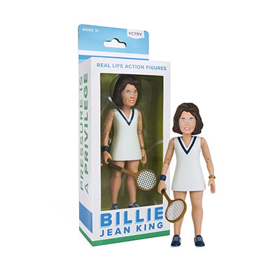 A brown hair woman wearing eyeglasses and a white tennis dress with a blue v accent collar holding a tennis racket with blue tennis sneakers and light blue laces, with a package containing the same figurine next to it